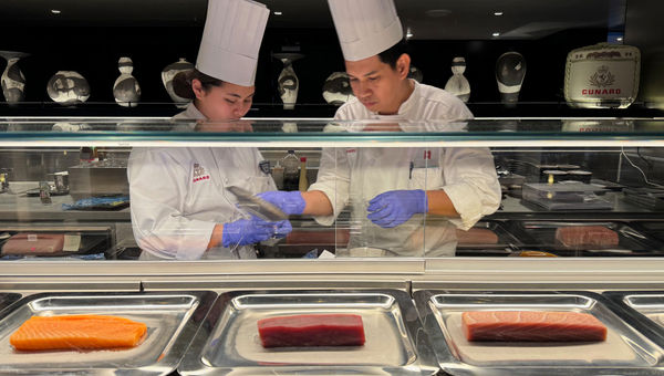 Sushi chefs behind the counter at Aji Wa, the Queen Anne's Japanese restaurant. Sushi chefs behind the counter at Aji Wa, the Queen Anne's Japanese restaurant.