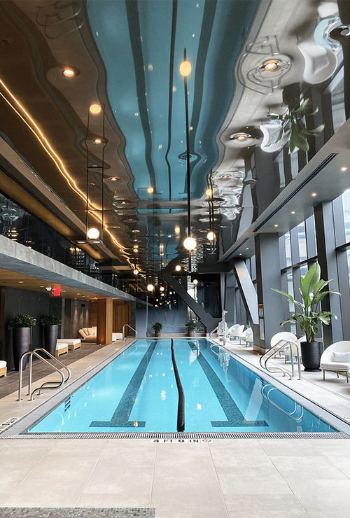The hotel's 20-meter lap pool is bathed in the light from floor-to-ceiling windows. The hotel's 20-meter lap pool is bathed in the light from floor-to-ceiling windows.