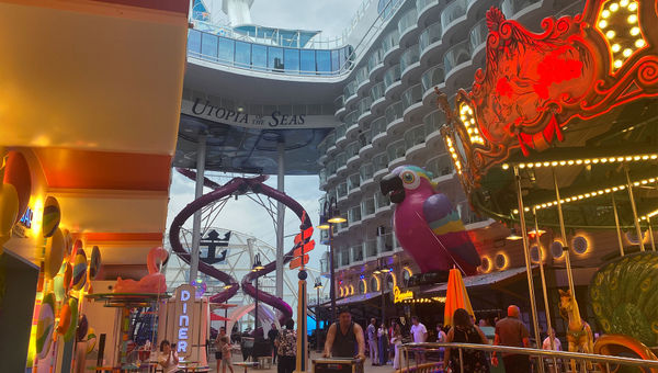 The Utopia of the Seas’ Boardwalk neighborhood with a carousel, giant parrot and the Ultimate Abyss slides. The Utopia of the Seas’ Boardwalk neighborhood with a carousel, giant parrot and the Ultimate Abyss slides.